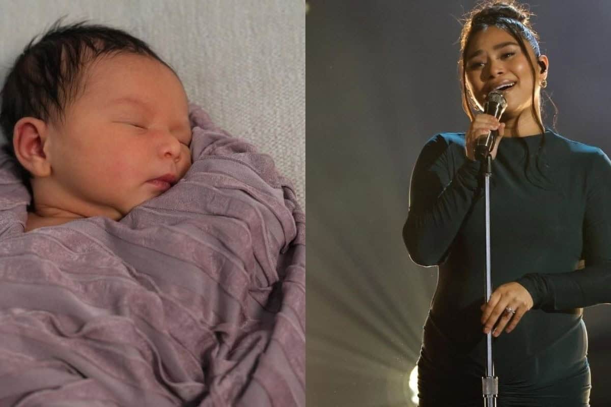 Adorable newborn baby sleeping soundly, wrapped in soft purple cloth.