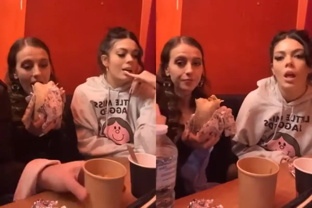 Group of young women enjoying food at a restaurant.