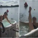 Relaxing woman enjoying a hot tub by the lake with scenic water views.