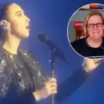 Viral Music FM: Female singer performing live on stage with a microphone, showcasing vibrant enterta.